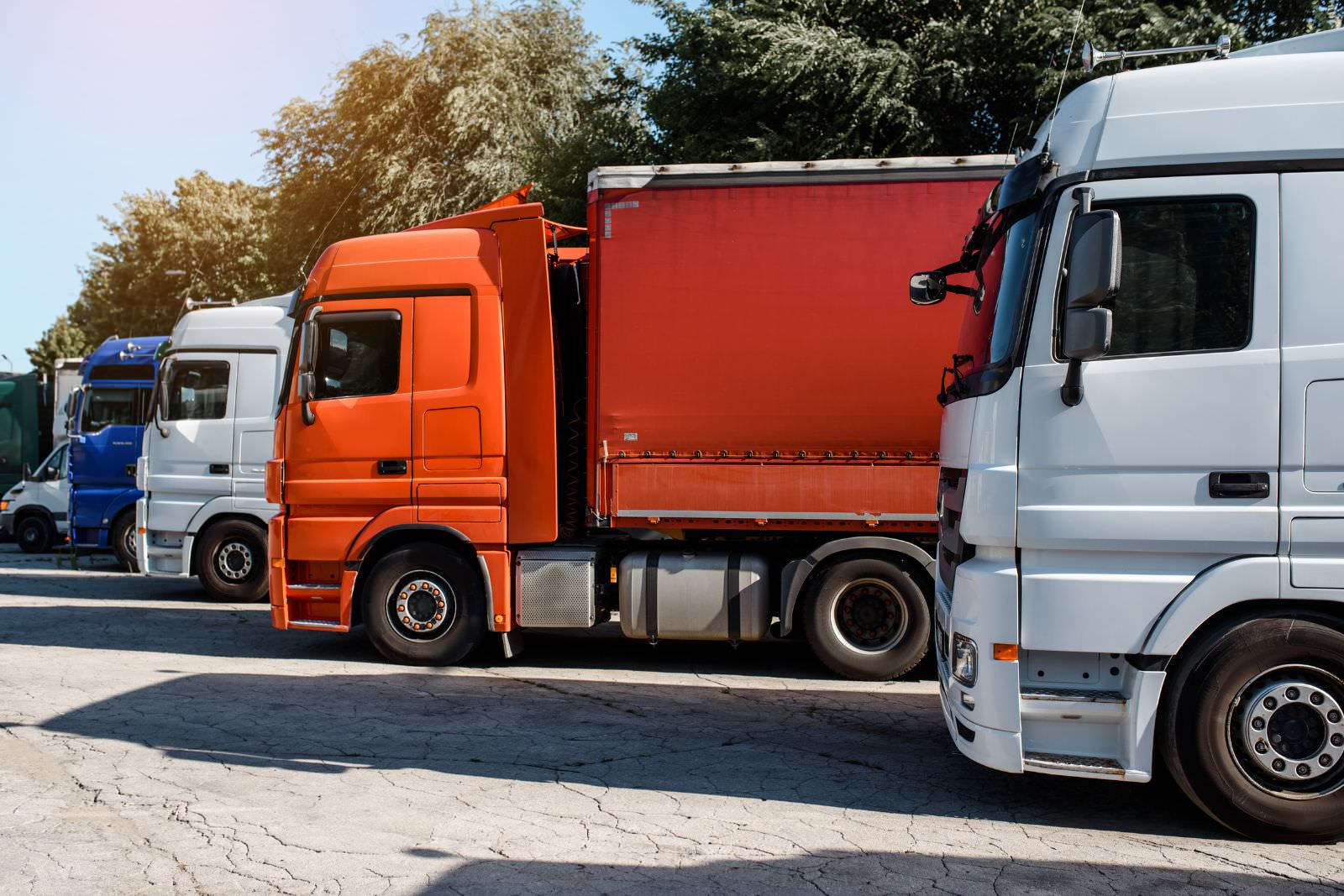 a row of semi trucks parked